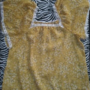 Women's mustard color blouse.